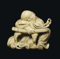 18TH 19TH CENTURY AN IVORY CARVING OF A SLEEPING LUOHAN